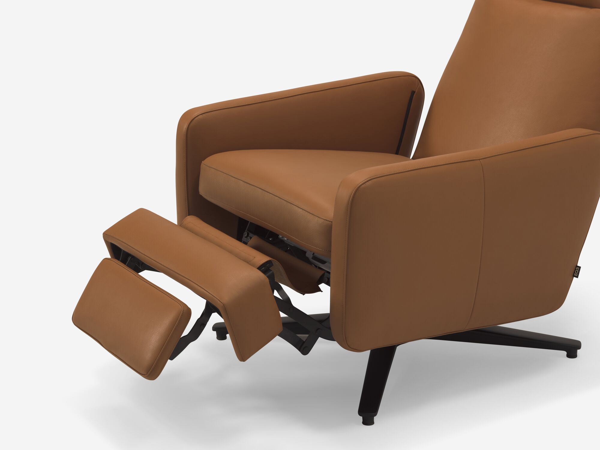 Seat detail view of brown leather reclining chair with foot rest reclined